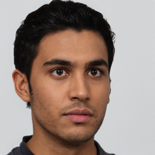 Neutral latino young-adult male with short  black hair and brown eyes