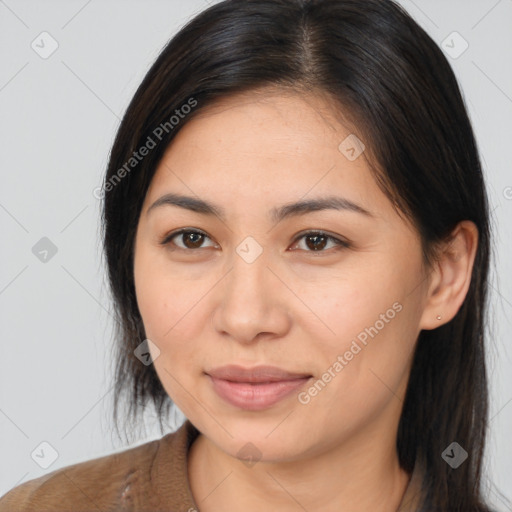 Joyful latino young-adult female with medium  brown hair and brown eyes