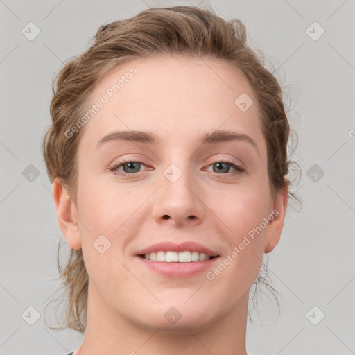 Joyful white young-adult female with medium  brown hair and blue eyes