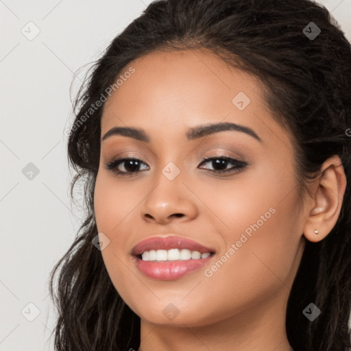 Joyful latino young-adult female with long  brown hair and brown eyes