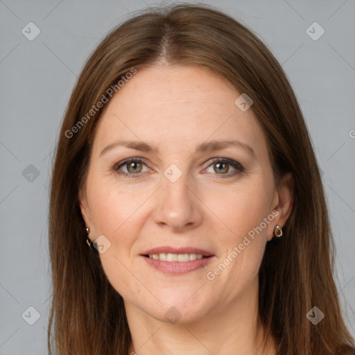 Joyful white adult female with long  brown hair and grey eyes