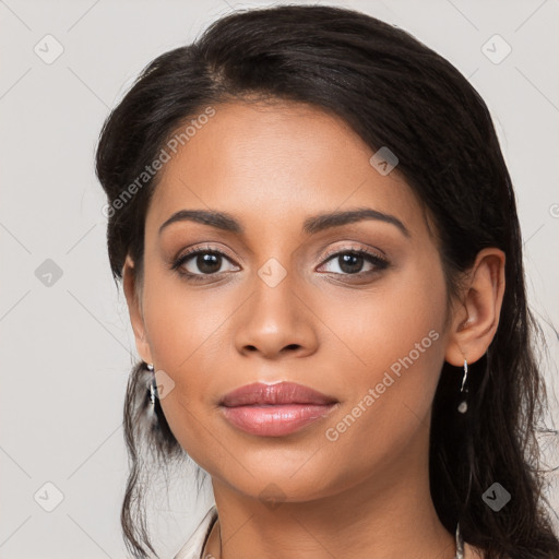 Joyful latino young-adult female with long  black hair and brown eyes