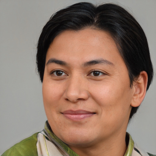Joyful asian adult female with medium  brown hair and brown eyes