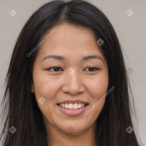 Joyful asian young-adult female with long  brown hair and brown eyes