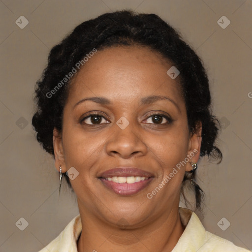 Joyful black adult female with medium  brown hair and brown eyes