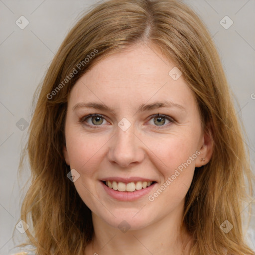 Joyful white young-adult female with long  brown hair and blue eyes