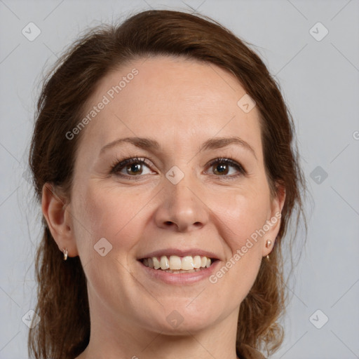 Joyful white adult female with medium  brown hair and grey eyes