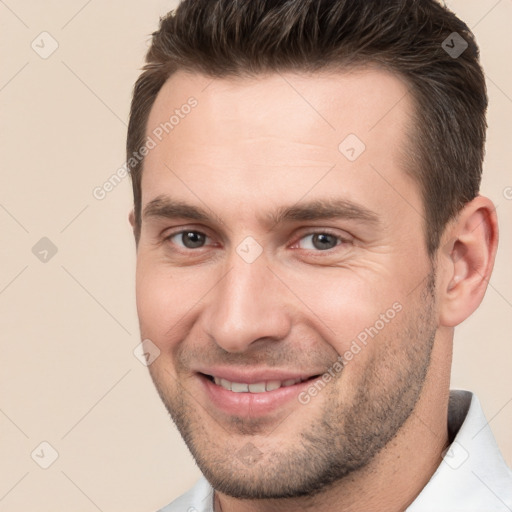 Joyful white young-adult male with short  brown hair and brown eyes