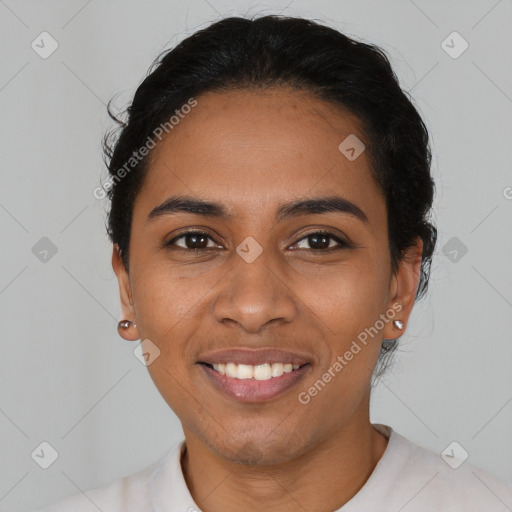 Joyful latino young-adult female with short  black hair and brown eyes