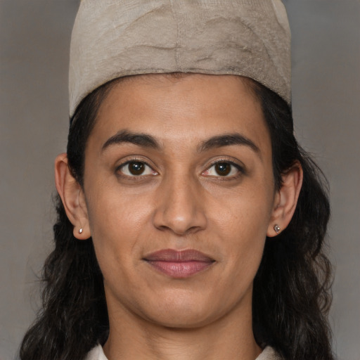 Joyful latino young-adult female with medium  black hair and brown eyes