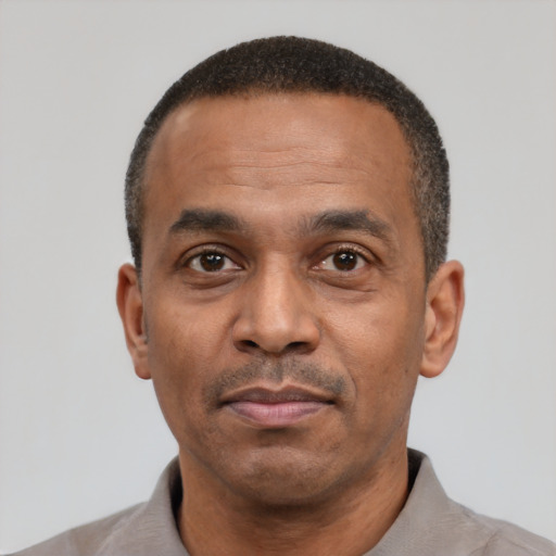 Neutral latino adult male with short  black hair and brown eyes
