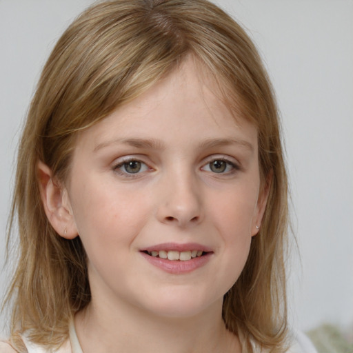 Joyful white child female with medium  brown hair and blue eyes