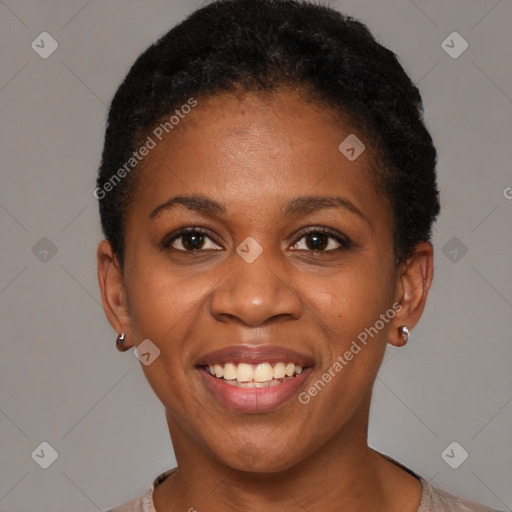 Joyful black young-adult female with short  black hair and brown eyes