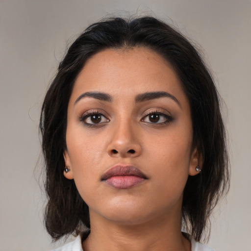 Neutral asian young-adult female with medium  brown hair and brown eyes
