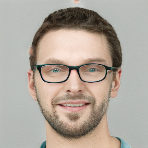 Joyful white young-adult male with short  brown hair and green eyes