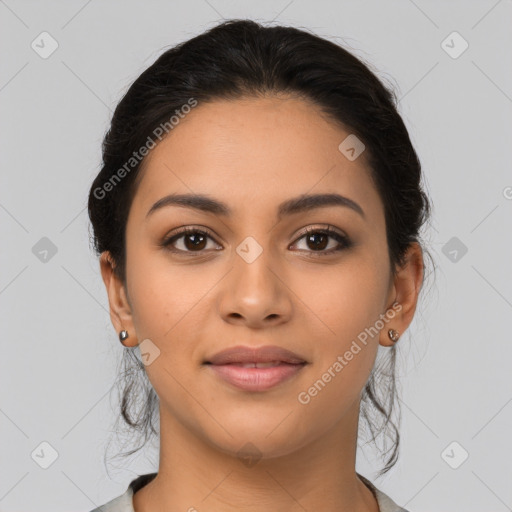 Joyful latino young-adult female with medium  brown hair and brown eyes