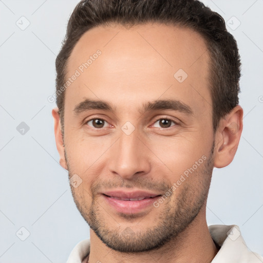 Joyful white young-adult male with short  brown hair and brown eyes