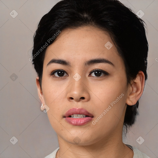 Joyful asian young-adult female with medium  black hair and brown eyes