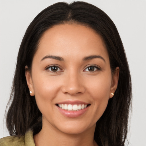 Joyful white young-adult female with long  brown hair and brown eyes