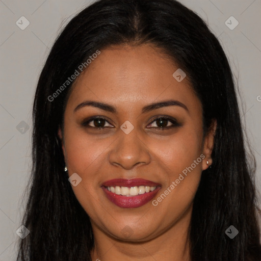 Joyful latino young-adult female with long  brown hair and brown eyes