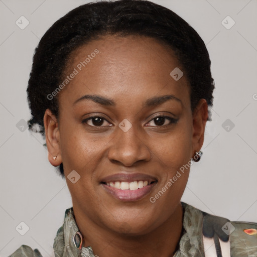 Joyful black young-adult female with short  brown hair and brown eyes