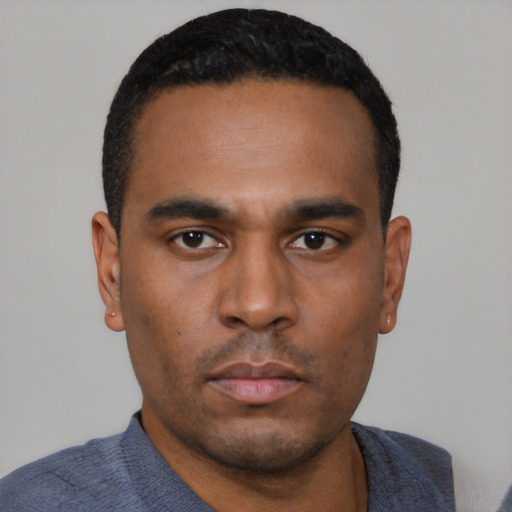 Neutral latino young-adult male with short  black hair and brown eyes