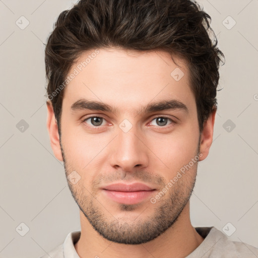 Neutral white young-adult male with short  brown hair and brown eyes