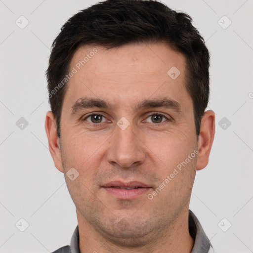 Joyful white adult male with short  brown hair and brown eyes