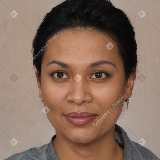 Joyful latino young-adult female with short  black hair and brown eyes