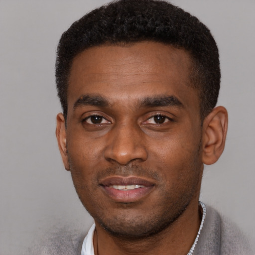 Neutral black young-adult male with short  brown hair and brown eyes