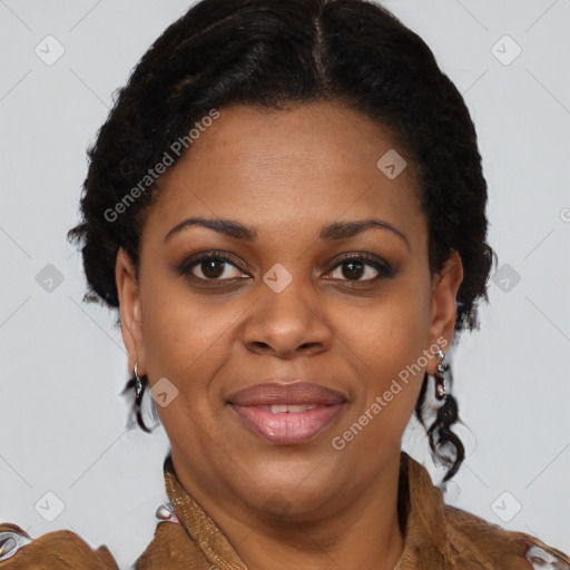 Joyful black adult female with short  brown hair and brown eyes