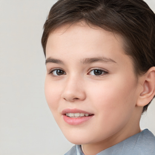 Joyful white child female with short  brown hair and brown eyes