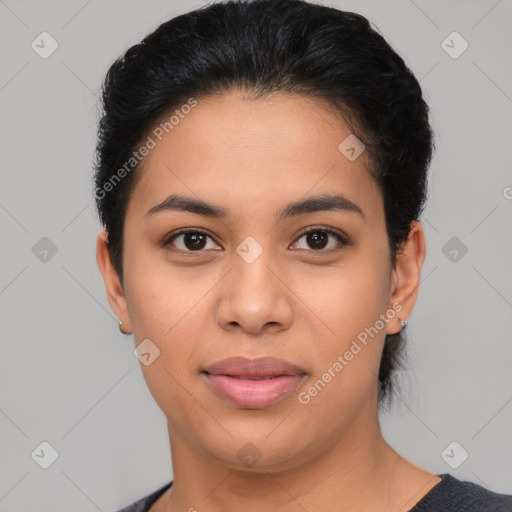 Joyful latino young-adult female with short  black hair and brown eyes