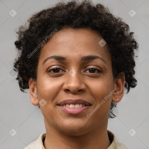 Joyful black young-adult female with short  brown hair and brown eyes