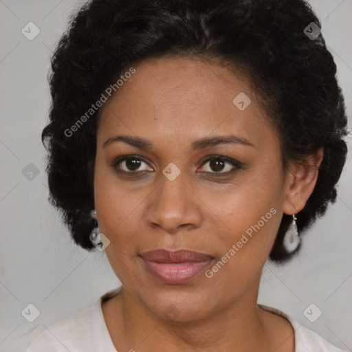 Joyful latino adult female with medium  brown hair and brown eyes