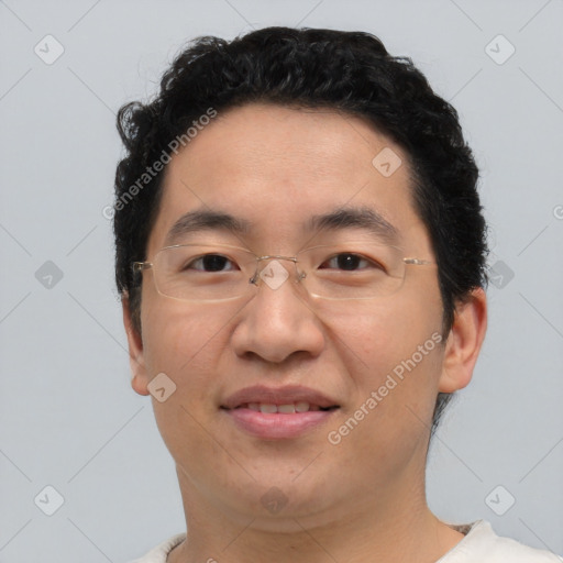 Joyful asian young-adult male with short  brown hair and brown eyes