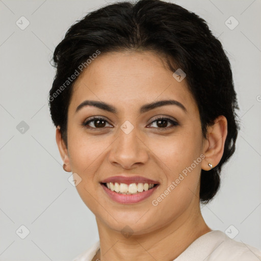 Joyful latino young-adult female with short  brown hair and brown eyes
