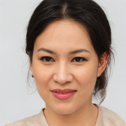 Joyful asian young-adult female with medium  brown hair and brown eyes