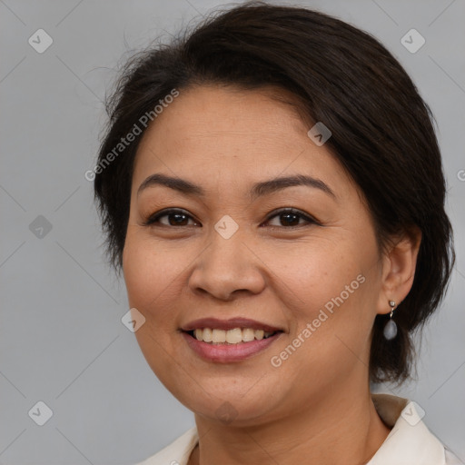 Joyful white adult female with medium  brown hair and brown eyes