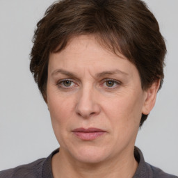 Joyful white adult female with short  brown hair and grey eyes