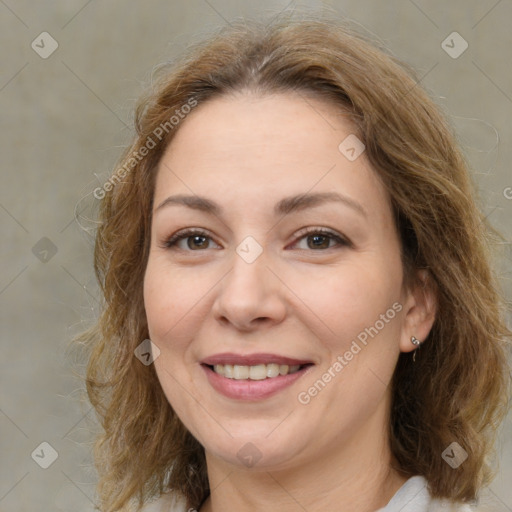 Joyful white adult female with medium  brown hair and brown eyes