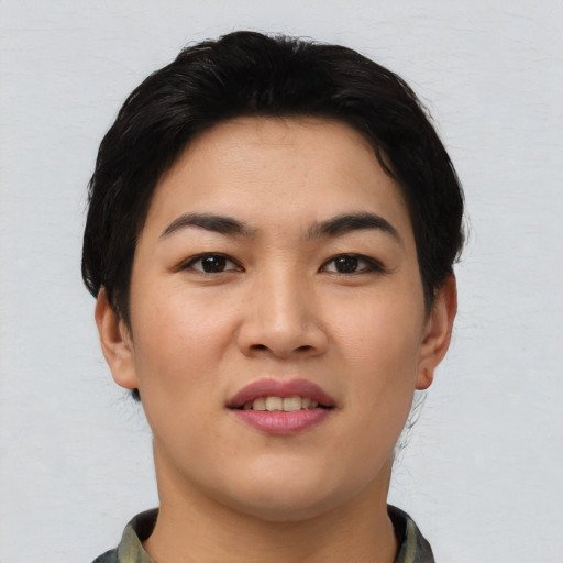 Joyful asian young-adult female with short  black hair and brown eyes