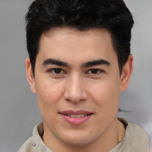 Joyful latino young-adult male with short  brown hair and brown eyes