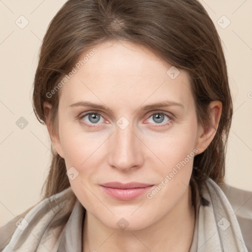 Joyful white young-adult female with medium  brown hair and blue eyes