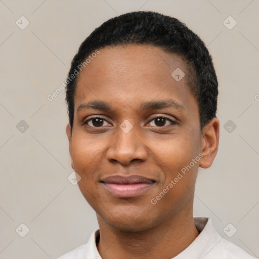 Joyful black young-adult female with short  black hair and brown eyes