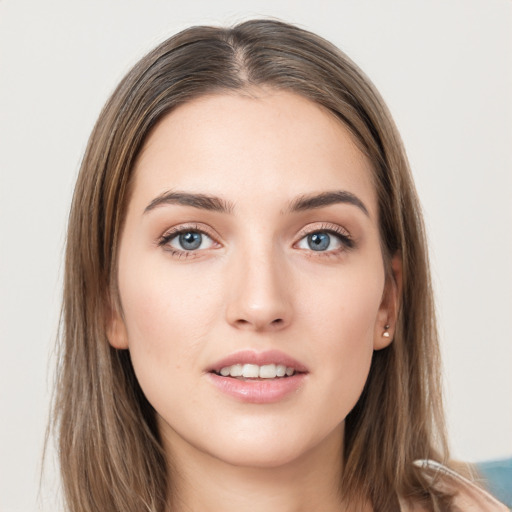 Joyful white young-adult female with long  brown hair and grey eyes