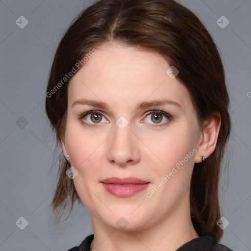 Joyful white young-adult female with medium  brown hair and blue eyes