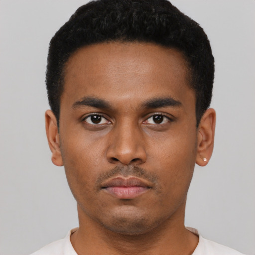 Neutral black young-adult male with short  black hair and brown eyes