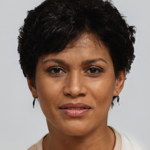 Joyful white young-adult female with short  black hair and brown eyes