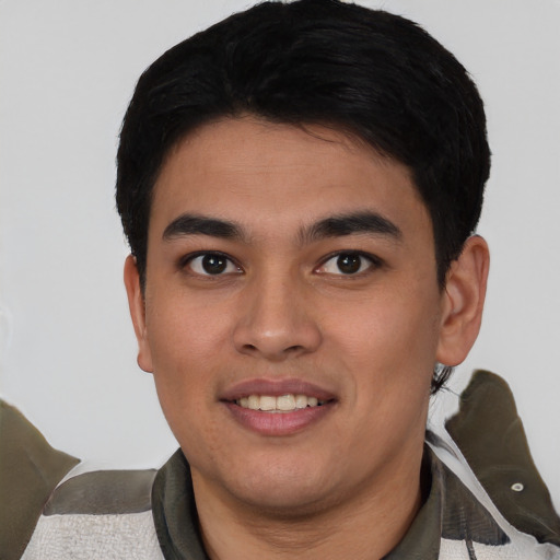 Joyful asian young-adult male with short  black hair and brown eyes
